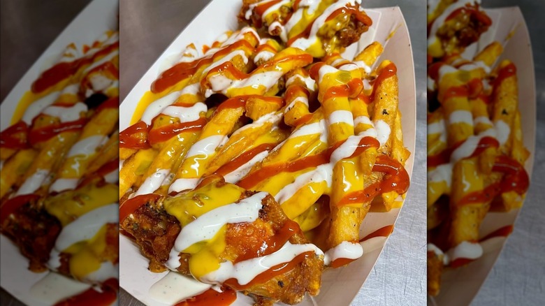 fries with ketchup and mustard at Dino's in Nashville, TN