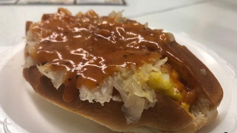 Close-up of a hot dog covered in chili sauce