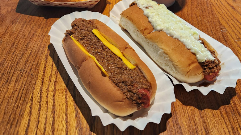 Two chili dogs on a table