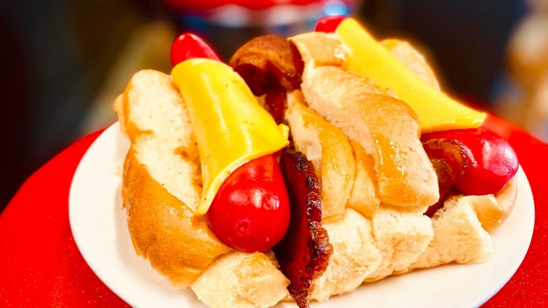 Two Maine-style hot dogs covered in cheese