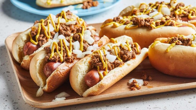 A bunch of hot dogs on a serving tray