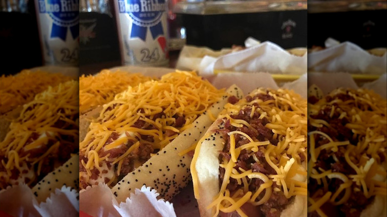 Close-up of chili dogs with cheese on top