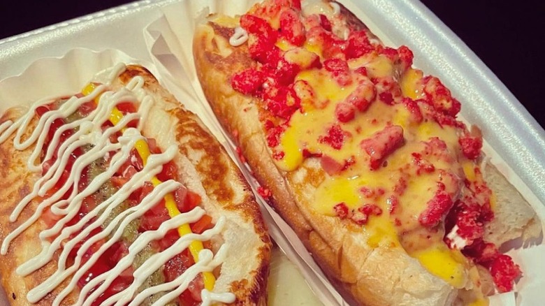A Sonoran hot dog and an Arizona hot dog with Cheetos