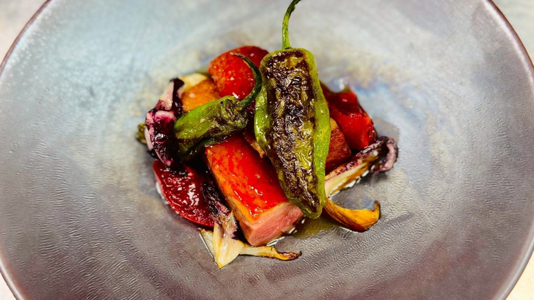 A plate of aged duck breast at BoccaLupo in Atlanta