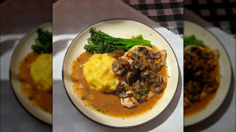 A plate of grilled salmon with risotto at Il Localetto Rossi in Albuquerque