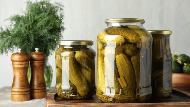 Pickle jars on wooden board