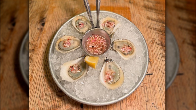 A plate of oysters with pink peppercorn & cara cara mignonette at Dylan's Oyster Cellar