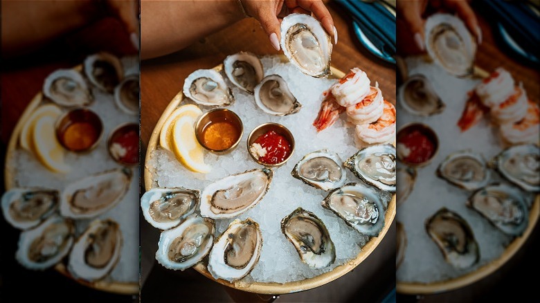 A plate of oysters and shrimp on a table at Matunuk Atelier