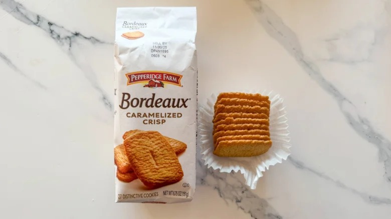 A package of Bordeaux Caramelized Crisp cookies with cookies outside the bag.