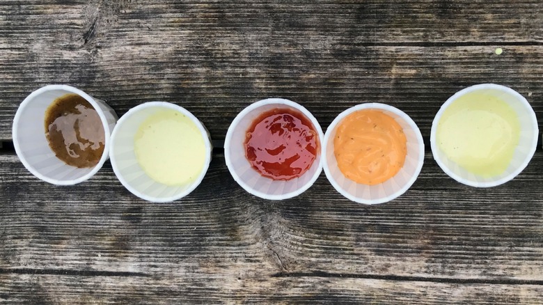 pretzel sauce samples in paper ramekins