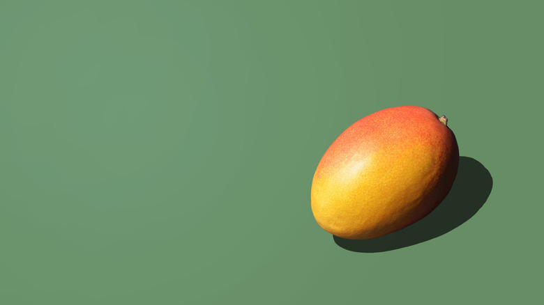 Fresh Mango on the green background
