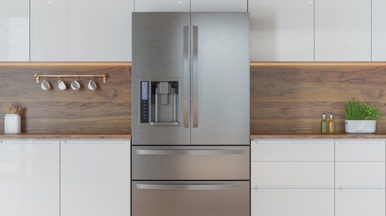shiny new fridge inside a modern, minimalist kitchen