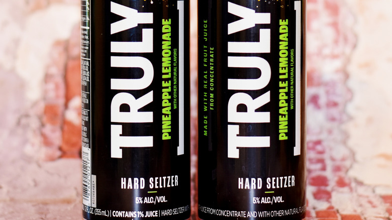 closeup of truly pineapple lemonade cans