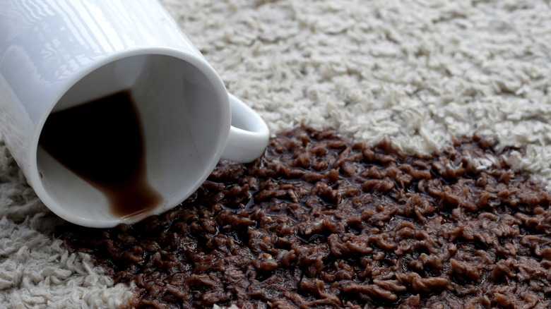 Coffee spilling onto a rug