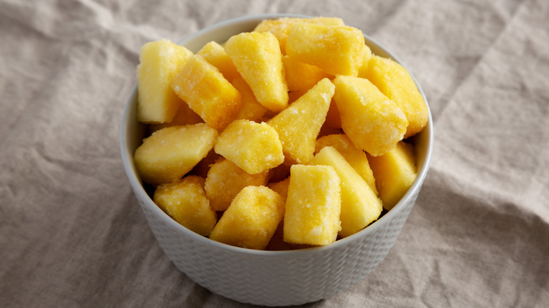 Frozen pineapple chunks in a bowl