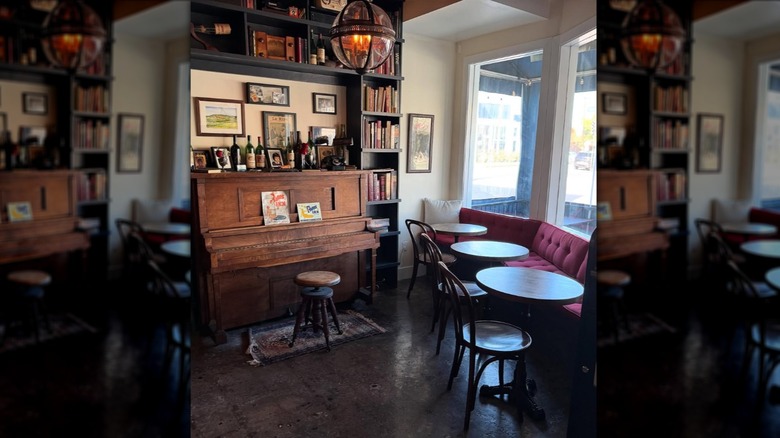 Cozy corner with an upright piano in Augustine Wine Bar