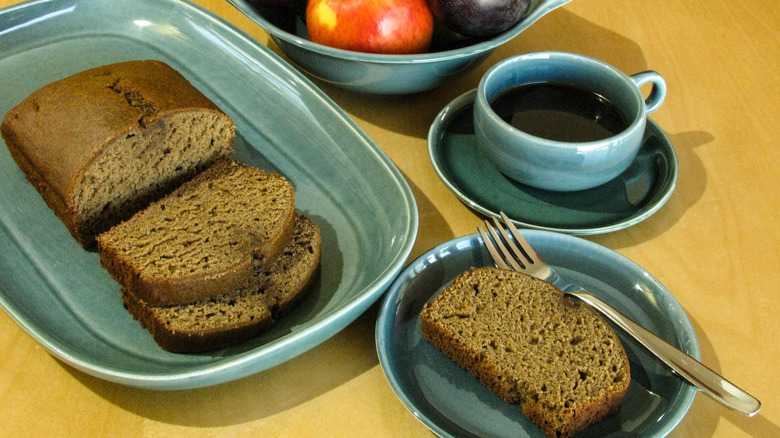 blue dish set from American Modern collection laid out on a wooden table