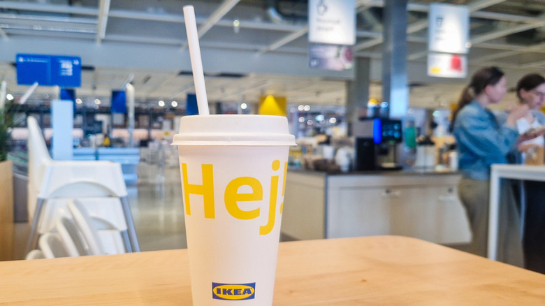 Ikea soda cup on cafeteria table.
