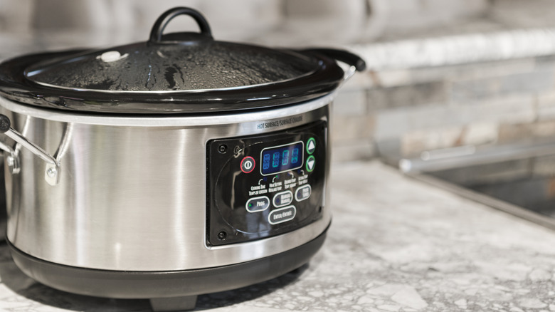 A slow cooker on a kitchen  countertop