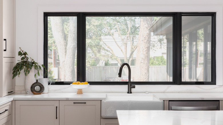 a kitchen with no window blinds