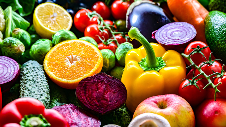 Colorful fruits and vegetables crowded together.