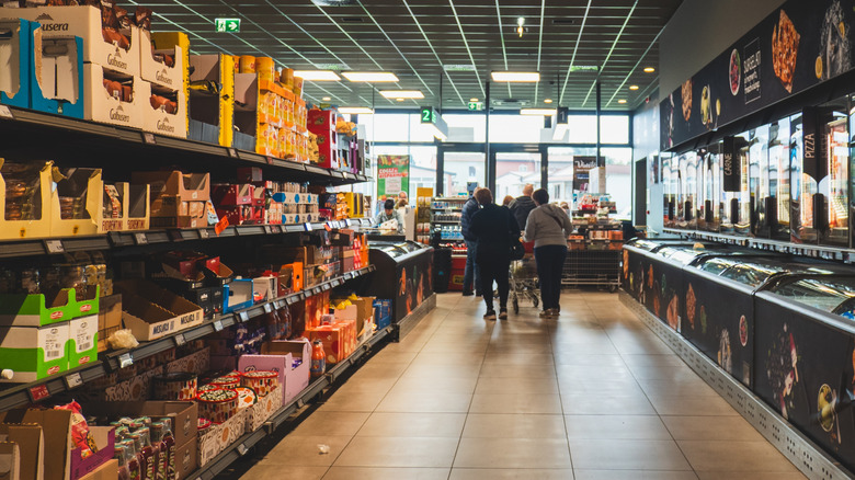 An aisle inside an Aldi store with shoppers