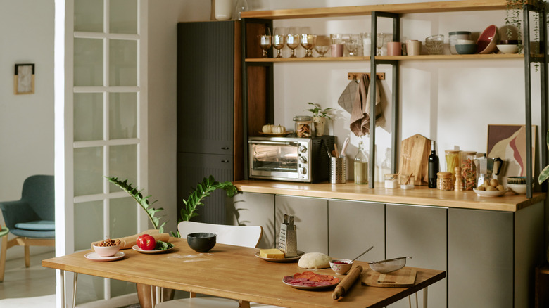 A homey kitchen with warm undertones, showcasing an organized counter space