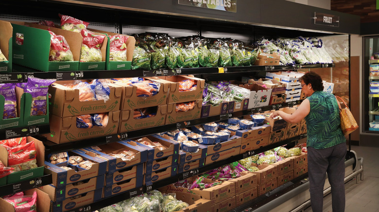 Woman shopping in Aldi produce section