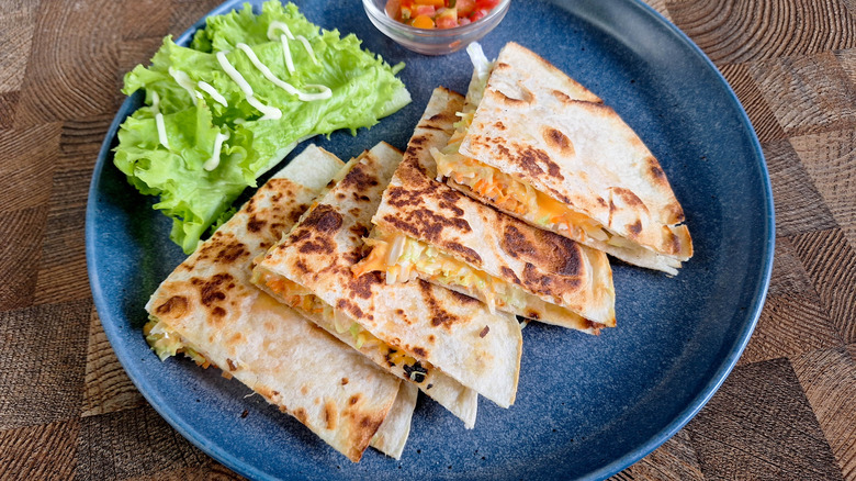 Quesadillas on a plate with salsa