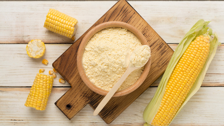 Masa harina in bowl with fresh corn