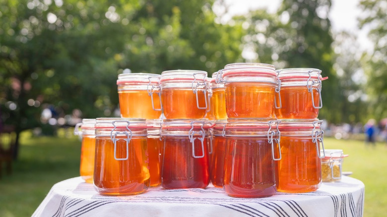 Jars of honey on a table.