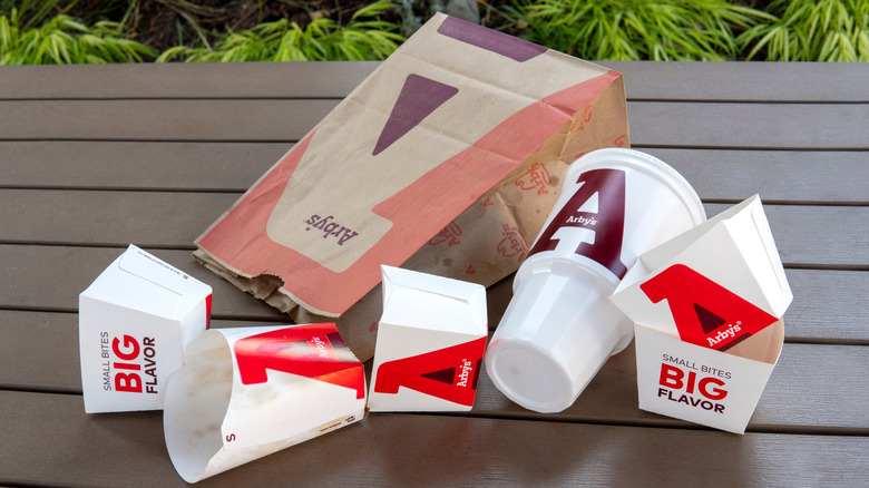 a collection of arby's containers