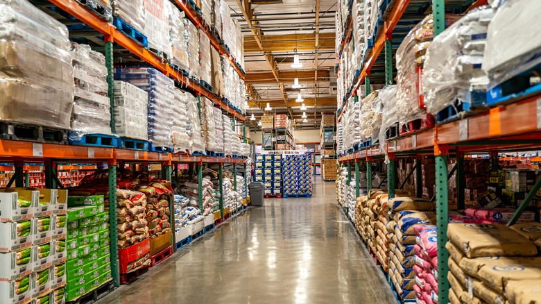 interior of a Costco with goods stacked on pallets