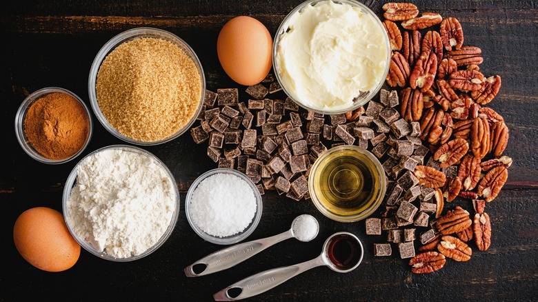 assorted ingredients for making chocolate bourbon pecan pie