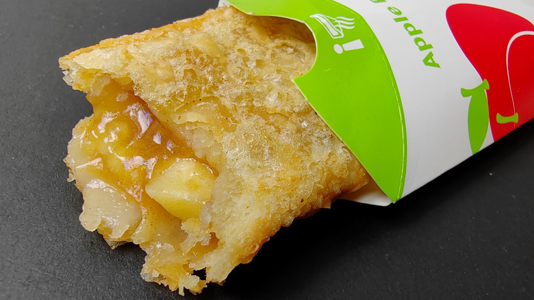 A close up of a McDonald's Apple Pie and its filling.