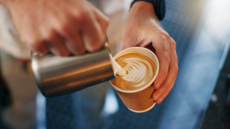 Someone pouring a coffee