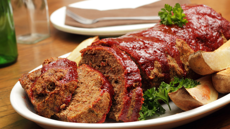 Sliced meatloaf garnished with parsley