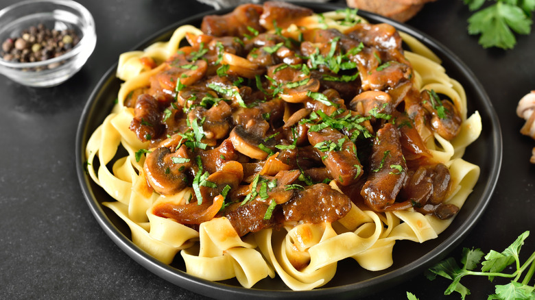 Plate of beef stroganoff with parsley garnish