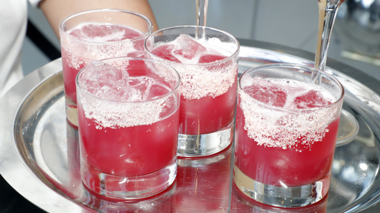 A tray of red margaritas on the rocks