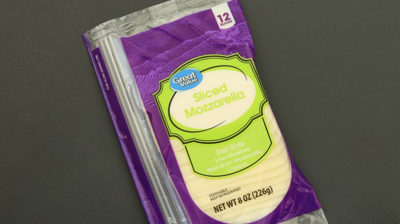 A package of Great Value mozzarella cheese on a gray background