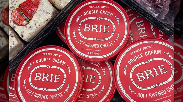 Wheels of Trader Joe's double cream brie at the store