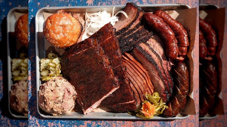 A tray full of BBQ meats and sides