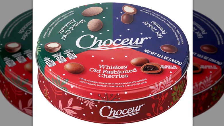 Choceur Holiday Nuts Tin divided into three sections to display its flavor variety.