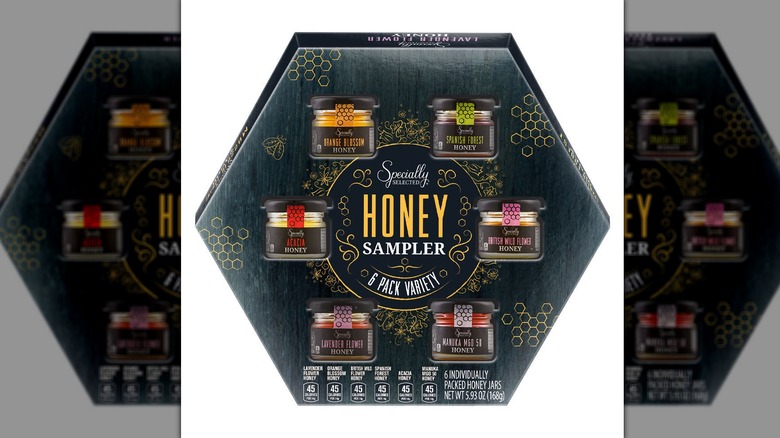 A box of Specially Selected Honey Sampler Variety Pack, showcasing its six varieties.