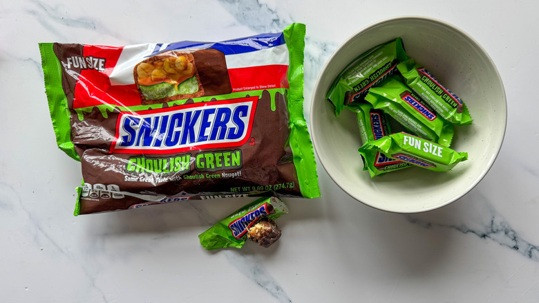 Snickers Ghoulish Green on marble surface