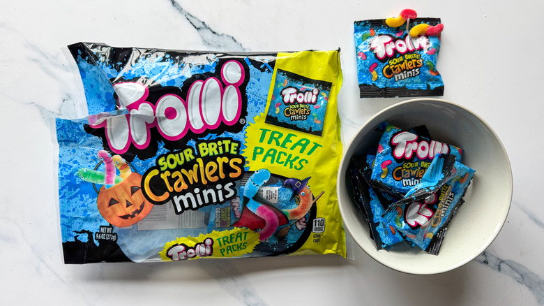 Trolli Sour Brite crawlers on marble surface