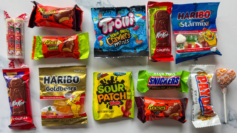 Halloween candy assorted on marble background