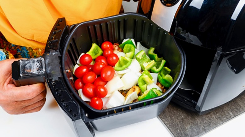 Vegetables entering air fryer