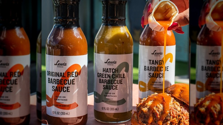 Three bottles of Lewis Barbecue hot sauce, woman pouring some over a chicken sandwich