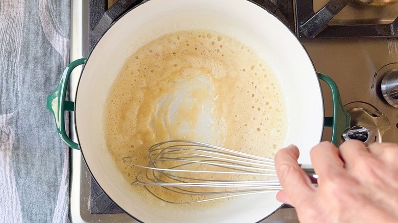 whisk in pot with flour and butter roux